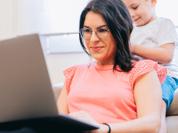 Mother working from home around kids