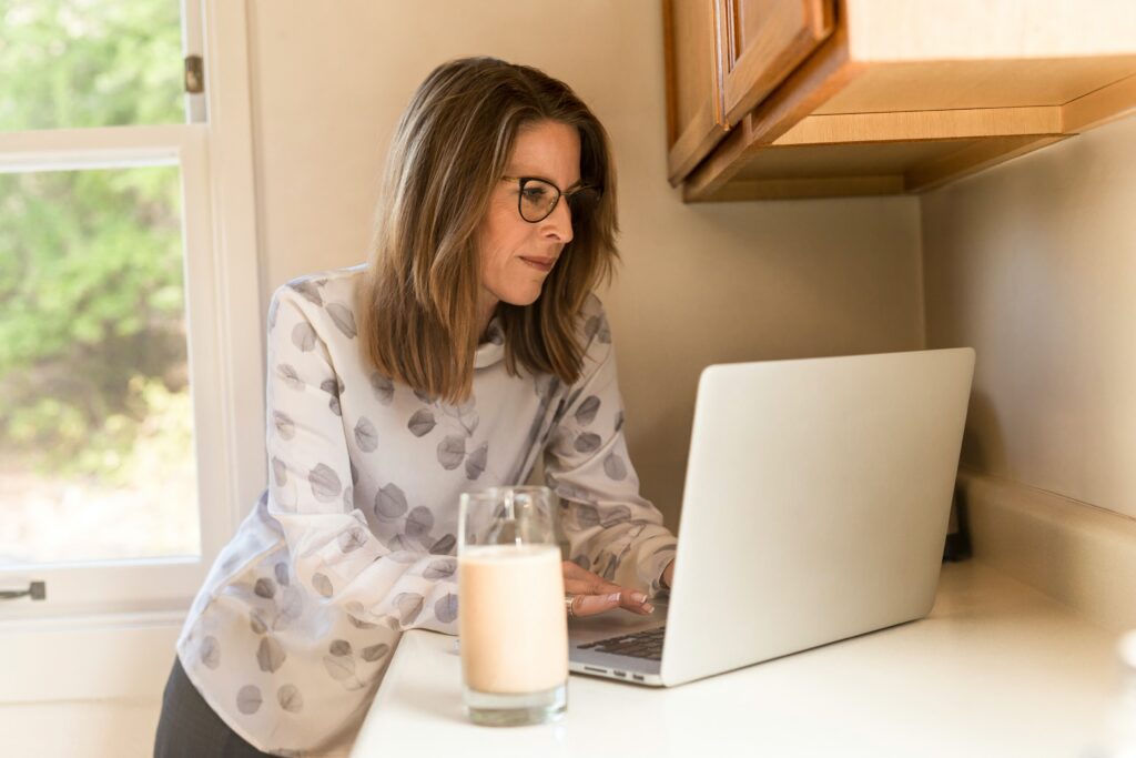 woman typing on laptop